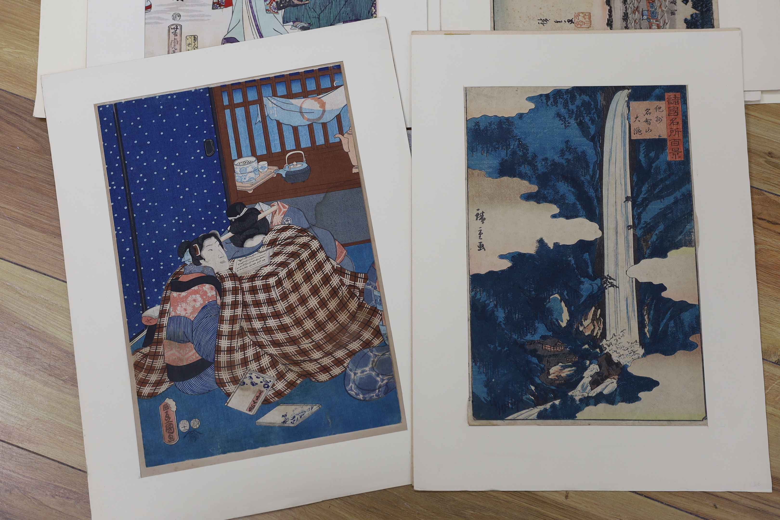 A folio of six Japanese woodblock prints, including examples after Utagawa Kunisada and Utagawa Kunisada II, mounted, unframed, 34 x 23cm